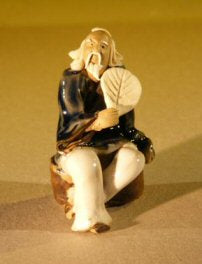 Miniature Figurine: Man Holding a Fan Sitting on a Rock - Blue Color - Fine Detail - Culture Kraze Marketplace.com