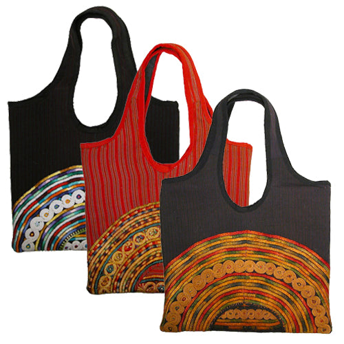 <center>Joyabaj Handbags made from Recycled Huipils</br>Measure: 14" high x 13" wide</center>