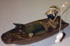 Ceramic Figurine Fisherman On A Boat Fishing With Duck - Culture Kraze Marketplace.com