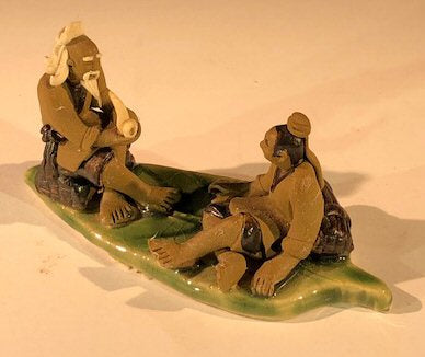 Miniature Ceramic Figurine  Two Mud Men On A Leaf, One Sitting Smoking a pipe, The Other Sitting - 2" - Culture Kraze Marketplace.com