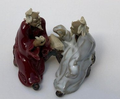 Ceramic Figurine Two Men Sitting On A Bench - 2.25" Holding a Pipe Color: Red & White - Culture Kraze Marketplace.com