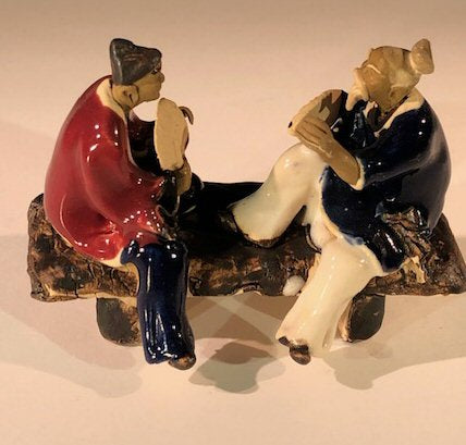 Ceramic Figurine Two Men Sitting On A Bench With Fans- 3" Color: Blue & Red - Culture Kraze Marketplace.com