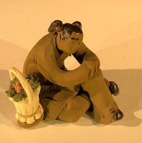 Ceramic Figurine  Mud Man Sitting With Basket Of Flowers - 2" - Culture Kraze Marketplace.com