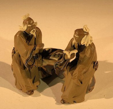 Ceramic Figurine Two Mud Men Sitting On A Bench Reading Books - 2.5" - Culture Kraze Marketplace.com