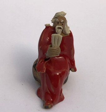 Miniature Ceramic Figurine Man Holding Pan Flute - 2" - Culture Kraze Marketplace.com