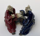 Ceramic Figurine Two Men Sitting On A Bench Holding a Pipe- 2.25" Color: Blue & Red - Culture Kraze Marketplace.com