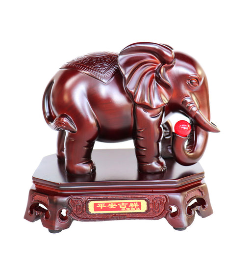 Feng Shui Elephant Holding a Red Jewel with Trunk Down - Culture Kraze Marketplace.com